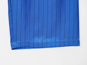 Close-up of blue striped satin fabric showing precise hem stitching and smooth texture