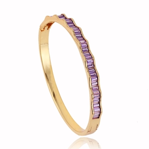 Elegant 18k gold plated wave bangle with channel-set purple baguette gemstones