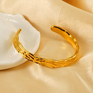 Minimalist irregular lava texture open bangle in gold-plated stainless steel for women