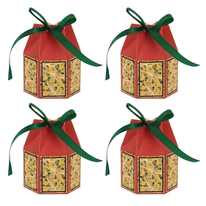 Set of four red Christmas candy boxes with green ribbons and gold berry prints