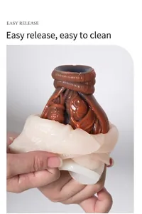 Mechanical heart silicone mold showing easy release process with a brown resin casting