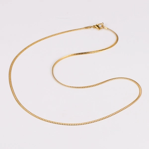 Detailed view of a sleek gold snake chain necklace with a secure lobster clasp closure