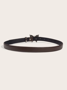Detailed macro view of the brown leather texture and metal butterfly buckle on the belt