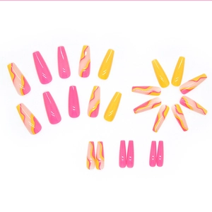 Long coffin press on nails featuring yellow and bright pink glossy abstract wave designs