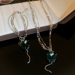Double-layered necklace and bracelet set with emerald green heart pendant and silver chains