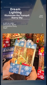 Close-up of blue Christmas snow globe lantern with miniature trees and snowman