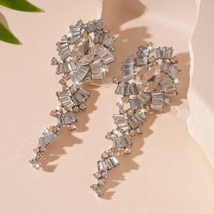 Luxurious silver flower drop tassel earrings with sparkling crystals and rhinestones