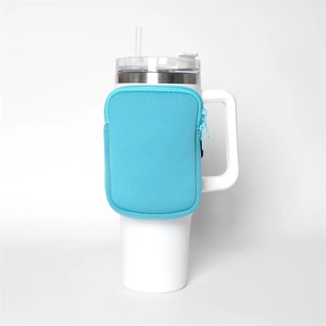 Detail view of a blue neoprene zipper pouch attached to a 40oz insulated tumbler cup