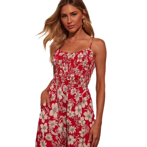Women's high waist red floral jumpsuit with smocked bodice and delicate white flower prints