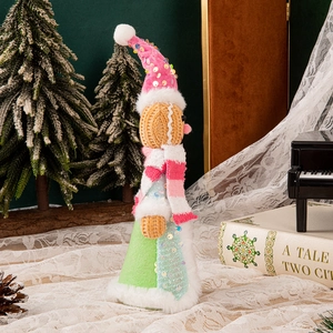 Standing Christmas gingerbread doll with pink sequin hat and striped scarf decoration