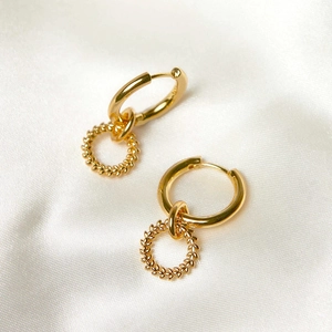 Vintage gold s925 silver triple interlocking textured hoop earrings on white silk