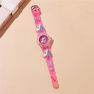 Close-up of kids pink quartz watch with 3D unicorn rainbow silicone strap and clear dial
