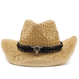 Close-up of hollow straw weave detail and silver bull head metal ornament on hat