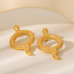 Detailed macro view of 18K gold-plated snake earrings with intricate scale texture