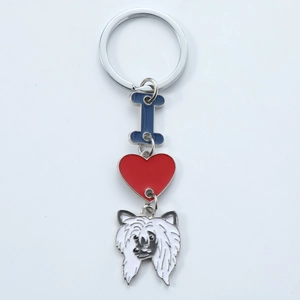 Detail of dog keychain with blue letter I red heart and white enamel dog charm