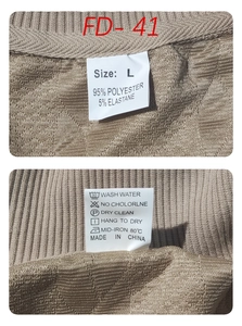 Detail view of garment care labels showing size L and 95% polyester fabric composition