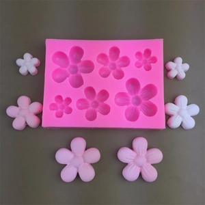 Detailed pink silicone mold for 16 small 3D flowers used in resin art and cake decoration