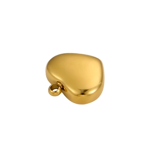 Close-up of polished 18k gold heart pendant with shiny finish and secure hanging loop
