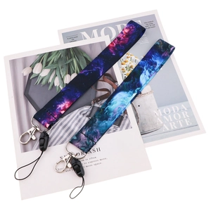 Detail of galaxy pattern lanyards with silver metal clips and black quick-release buckles