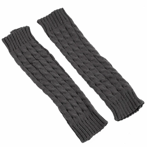 Detailed view of dark grey cable knit leg warmers with thick texture and ribbed cuffs