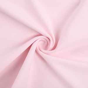 Detail of soft pink fabric with smooth texture and fine weave for elegant dresses
