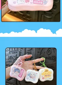 Detailed close-up and hand-held view of colorful mini animal game machine keychains