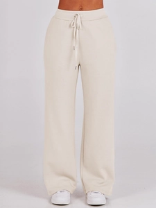 Detail view of oatmeal beige wide-leg joggers with a high-waisted drawstring design