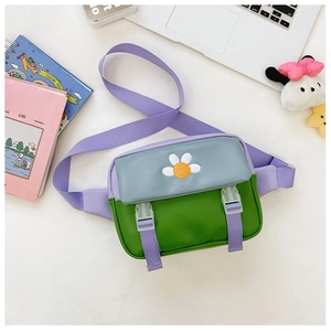 Detail of color-block kids crossbody bag with daisy embroidery and plastic buckle