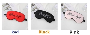 Three silk sleep masks in red black and pink with Good Night embroidery detail