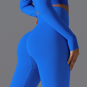 Macro detail of seamless bright blue yoga set featuring ribbed compression waistband fabric