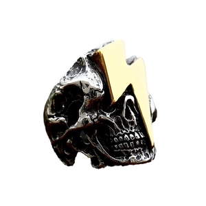 Gothic punk skull ring in vintage silver and gold finish with thunderbolt design