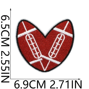 Macro detail of red heart embroidery patch with football stitch texture and dimensions