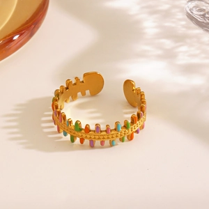 18K gold-plated stainless steel fishbone ring with colorful enamel inlay in soft lighting