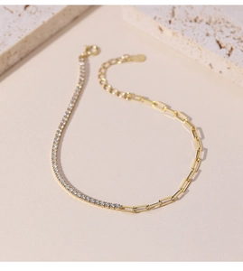Detail of gold paperclip chain and diamond tennis link bracelet with lobster clasp