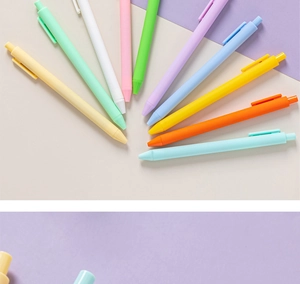 Flat lay of colorful macaron morandi ballpoint pens in a fan-shaped arrangement