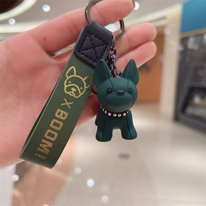 Handheld dark green resin French Bulldog keychain with matte finish and leather strap