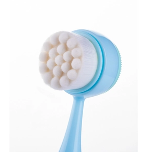 Dual-sided facial cleansing brush with soft white bristles and light blue handle