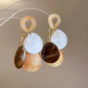Retro geometric resin drop earrings in cream, white and brown with gold links