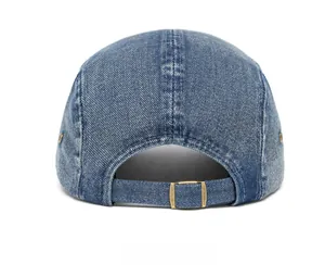 Detail of blue denim baseball cap back with vintage copper adjustable metal buckle