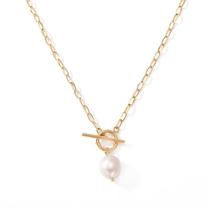 Detailed shot of golden T-bar toggle clasp necklace with a natural baroque pearl pendant