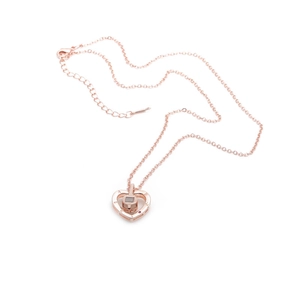 Rose gold heart pendant necklace featuring micro-set zircon and evil eye motif on white background