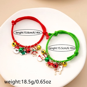 Detailed view of woven Christmas bracelets with enamel Santa and reindeer charms