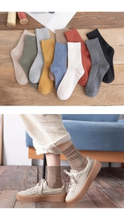 Detailed knit texture and vertical ribbing on cotton mid-calf socks in earthy tones