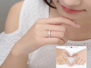 Detailed view of silver frosted titanium steel ring on finger for couples fashion