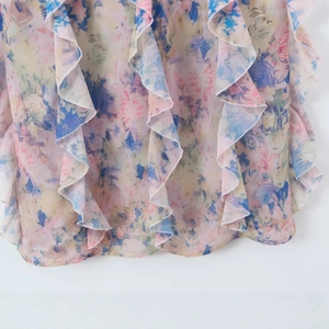 Floral print summer maxi dress with ruffle trim detail in vibrant pastel colors