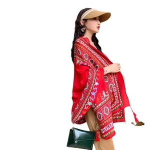 Ethnic red oversized shawl with bohemian geometric patterns and fringe tassels for beach travel