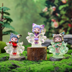 Macro shot of three Nine-Tailed Fox fairy figurines with translucent gradient tails