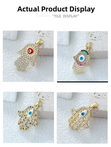 Macro shot of Hamsa hand pendants with evil eye designs and colorful zircon stones