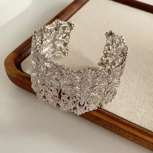 Retro hollow floral pattern wide cuff bracelet in silver finish with lace design