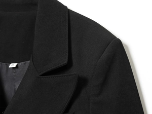 Detail of the high-quality twill texture and collar stitching on this black blazer dress